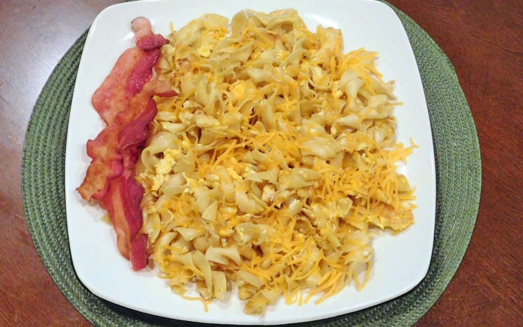 Pasta Bacon Eggs Breakfast Overload plate